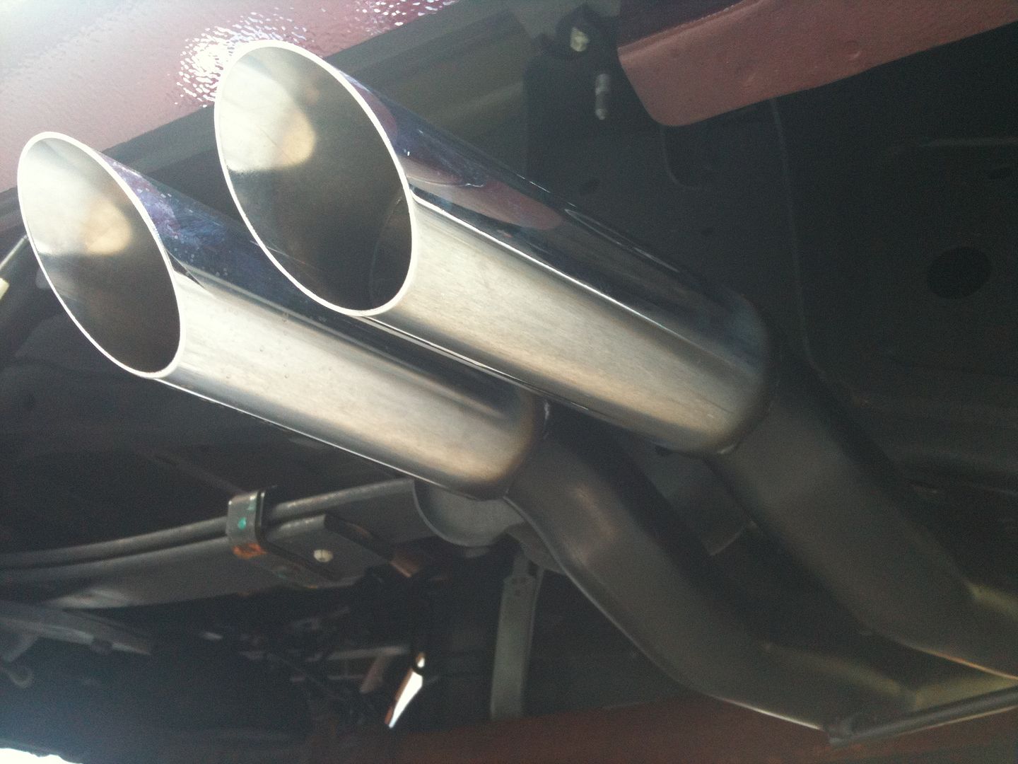 Side exit exhaust in front of rear tires what about driver's side