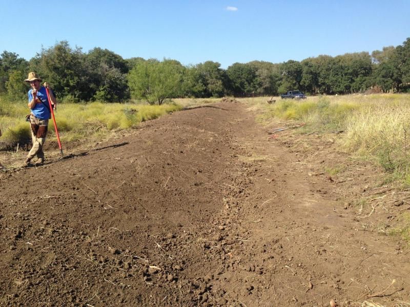One finished 200+ foot long swale and berm.